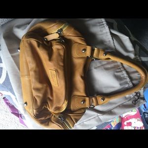 Sorial mustard perforated leather handbag